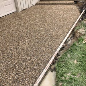 An exposed aggregate concrete walkway.