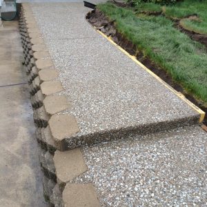 An exposed aggregate concrete walkway.