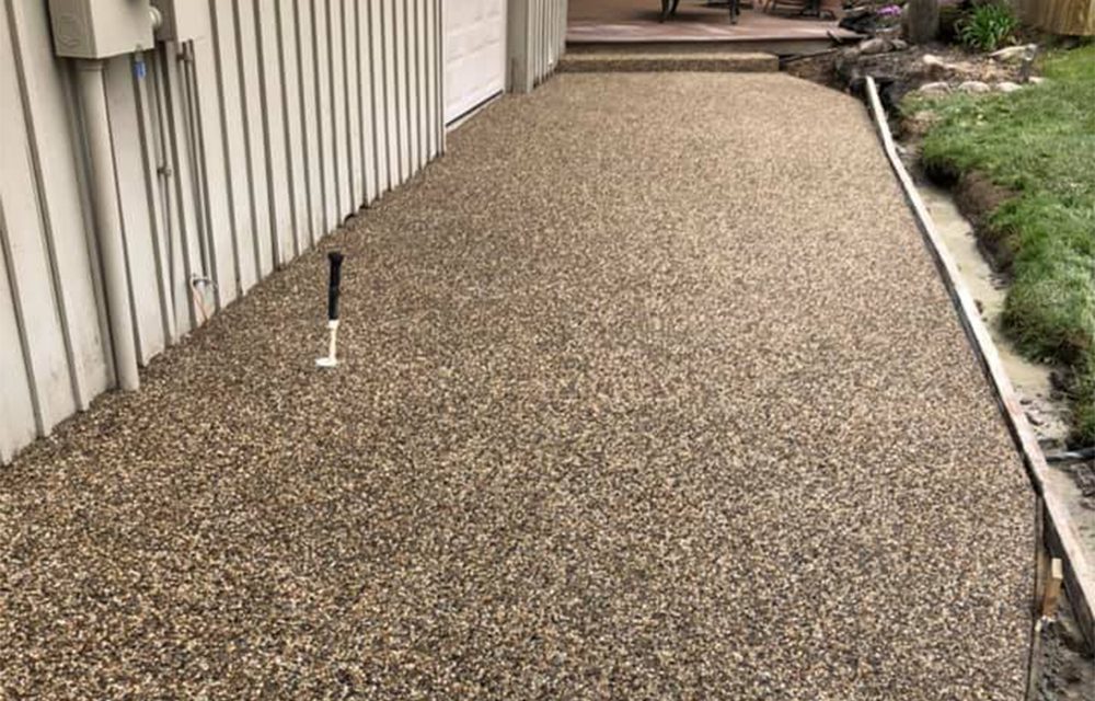 An exposed aggregate concrete walkway.