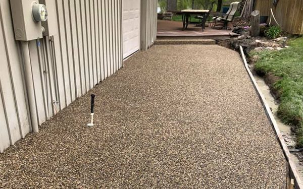 An exposed aggregate concrete walkway.