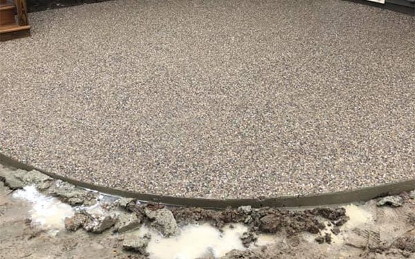 An exposed aggregate concrete walkway.