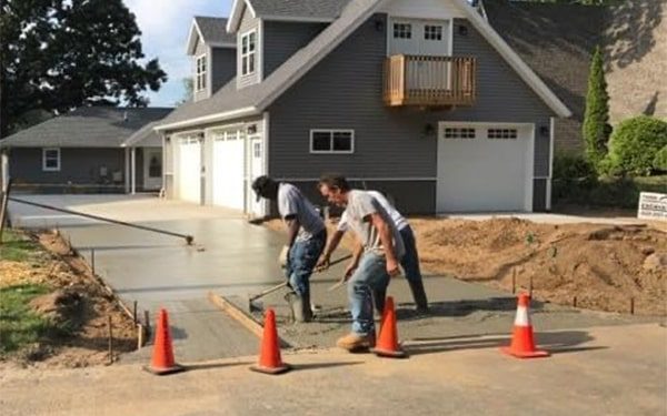 A concrete driveway under construction.