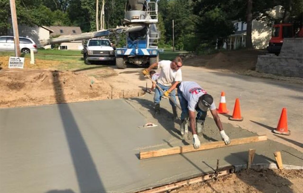 A concrete driveway under construction.