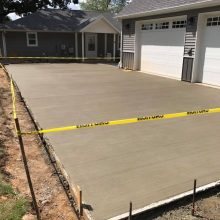 A concrete driveway under construction.