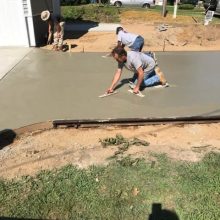 A concrete driveway under construction.