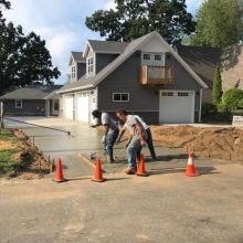 A concrete driveway under construction.