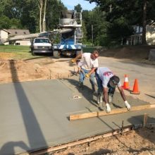 A concrete driveway under construction.