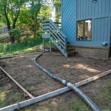 An under construction concrete patio for an office building.