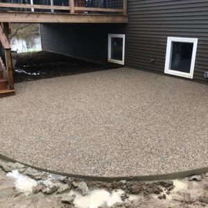 An exposed aggregate concrete patio.