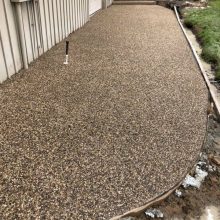 An exposed aggregate concrete walkway.