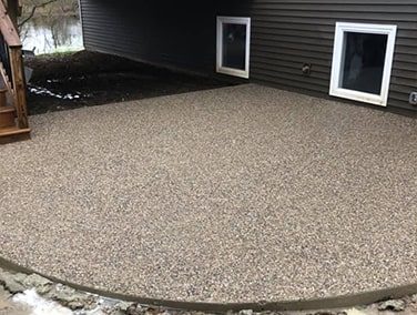 An exposed aggregate concrete patio.